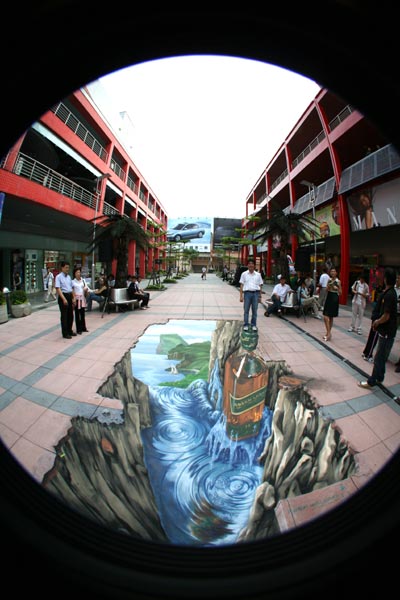 People being photographed in 3D optic illusion in Taipei