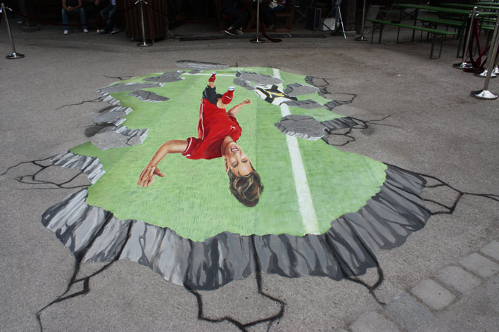Upside down view of 3D street painting for Mario Gomez from Puma