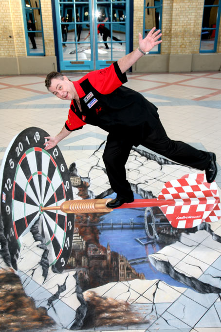 John Part posing with 3d optic illusion street painting at world darts championship