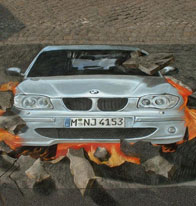 BMW busting pavement in a street painting illusion