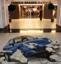 Car busting through shopping mall floor
